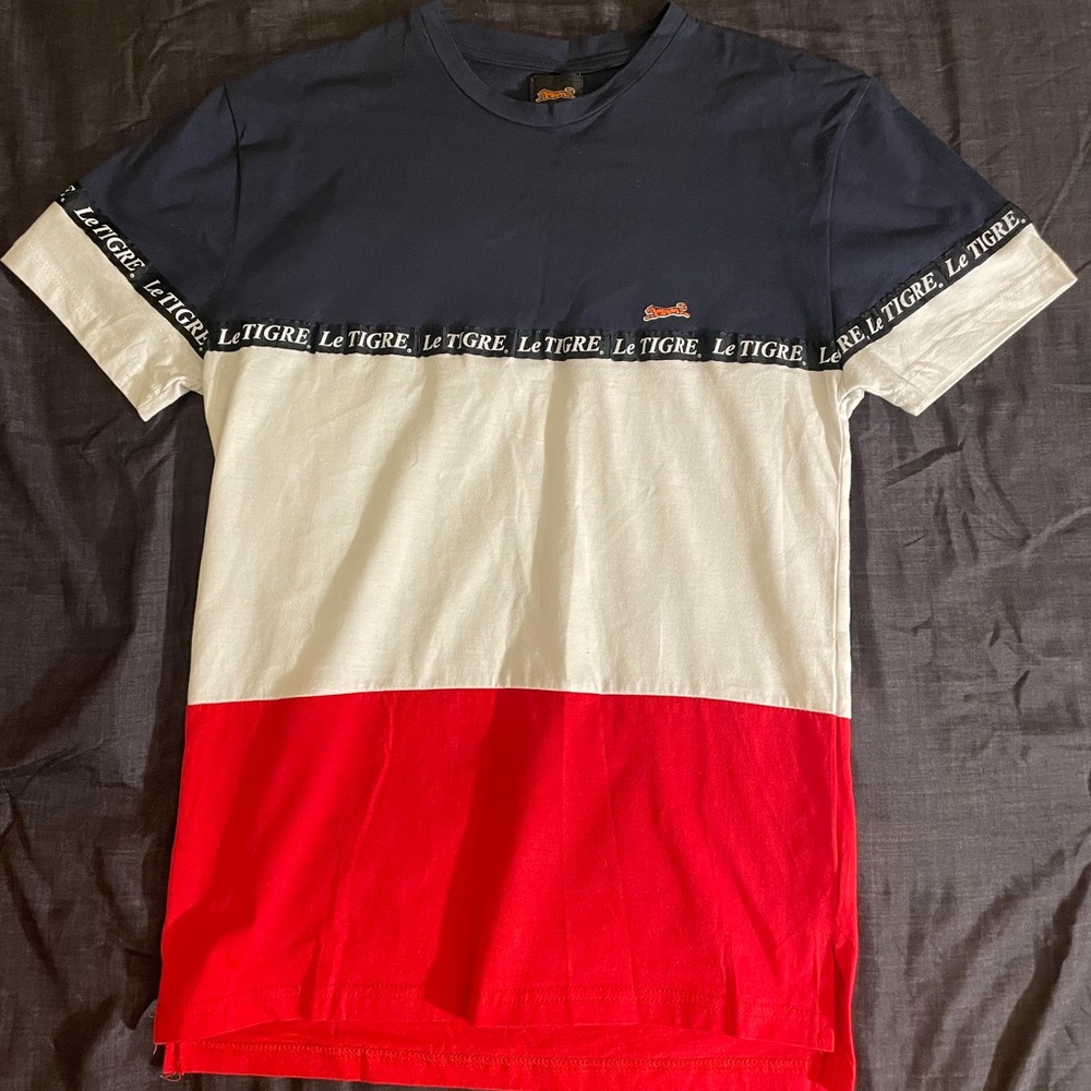 A Le Tigre shirt, similar to the shirt “Mitch” wore in the movie Paid In Full.